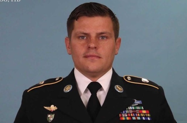 Staff Sgt. Manfredo Madrigal, an infantryman, poses for his official photo on February 14, 2018.