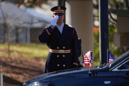 A U.S. service member with the Ceremonial Honor Guard salutes the hearse of President Jimmy Carter, 39th President of the United States, during his departure from The Carter Center at his state funeral service in Atlanta, Jan. 7, 2025. Carter, who...