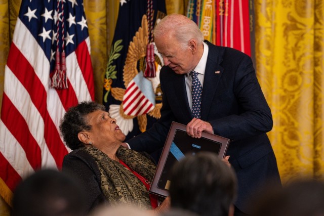 President Joe Biden presents the Medal of Honor for former Army Pfc. Charles Johnson to his sister, Juanita Mendez, during a Medal of Honor Ceremony at the White House, Jan. 3, 2025. Johnson – one of seven U.S. Soldiers from the Korean and Vietnam Wars to receive the Medal of Honor at the White House today – was posthumously recognized and honored for his acts of valor while saving the lives of ten comrades during the Korean War at Outpost Harry, June 11-12, 1953, while serving as a Browning automatic rifleman with Company B, 15th Infantry Regiment, 3rd Infantry Division. (U.S. Army photo by Henry Villarama)