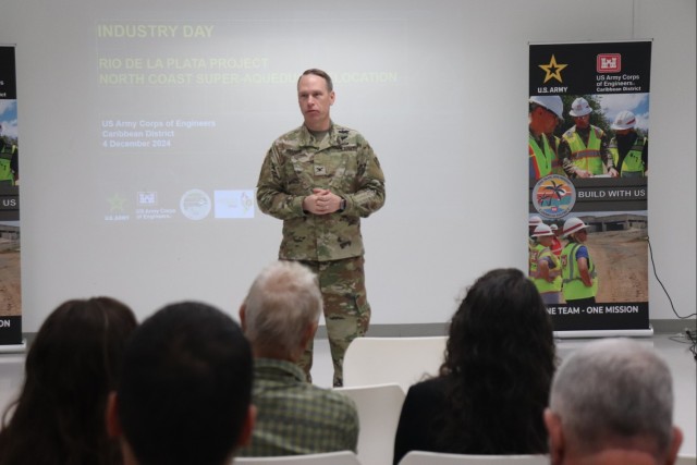 Military member addresses attendees during an event