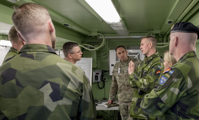 Swedish military staff officers meet with leaders of the New York Army National Guard’s 42nd Infantry Division at Fort Indiantown Gap, Pennsylvania, during a command post exercise Nov. 21, 2024. The command post exercise was one of three held to prepare the division for a Warfighter exercise that begins Jan. 24, 2025.