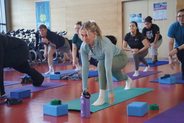 Catherine Hojnacki participates in a yoga class during Fitness Day, Jan. 11, 2025, at Tower Barracks, Germany.