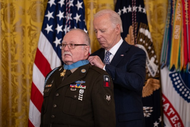 President Joe Biden awards the Medal of Honor to former Army Spc. 4th Class Kenneth David during a ceremony at the White House, Jan. 3, 2025. David – the only living recipient among the seven U.S. Soldiers from the Korean and Vietnam Wars to receive the Medal of Honor today – was recognized and honored for his acts of gallantry and intrepidity above and beyond the call of duty while serving as a radio operator with Company D, 1st Battalion, 506th Infantry Regiment, 101st Airborne Division, during combat operations on May 7, 1970 near Fire Support Base Maureen, Thua Thien province, Republic of Vietnam.