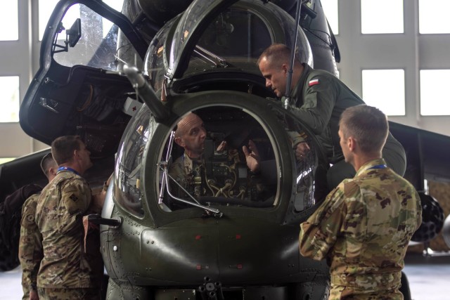U.S. Army Col. Ryan Kendall, commander of the 12th Combat Aviation Brigade, participates in a tour of an attack helicopter alongside Polish Soldiers at the Polish Apache Initiative summit in Inowrocław, Poland, on August 6, 2024. This initiative...