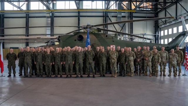 U.S. and Polish Military leaders in attendance pose for a picture at the Polish Apache Initiative summit, Inowrocław, Poland, on August 7, 2024. The initiative taught organizational leaders on AH-64 organizations, combat tactics and maintenance...