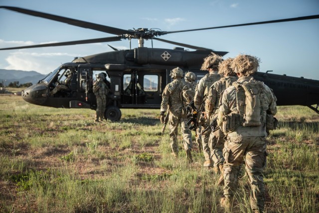 Soldiers assigned to the 3rd Assault Helicopter Battalion, 4th Aviation Regiment, 4th Combat Aviation Brigade, 4th Infantry Division, board a UH-60 Black Hawk June 5, 2024, during the division’s Ivy Mass exercise on Fort Carson, Colo. The...