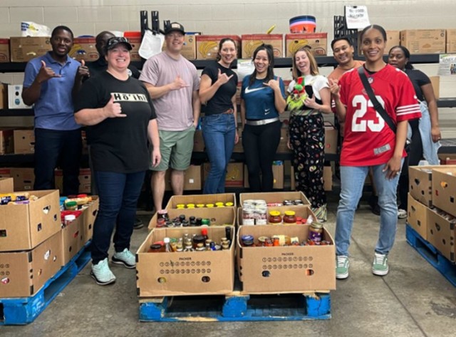 Team members sorting and stacking food pallets to be distributed around the island.