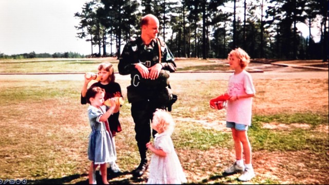 Young Lt. Gen. John Morrison Jr. (then a junior officer or field grade officer) with his four young daughters.