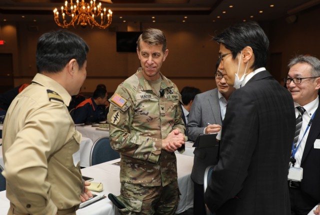 Col. Marcus Hunter, center, commander of U.S. Army Garrison Japan, greets Japanese partners before a downed aircraft exercise at Camp Zama, Japan, Jan. 28, 2025. More than 50 representatives from across the garrison, U.S. Army Japan, South Kanto Defense Bureau, and Zama and Sagamihara cities attended the tabletop exercise that demonstrated how they would manage an aircraft mishap near the installation.