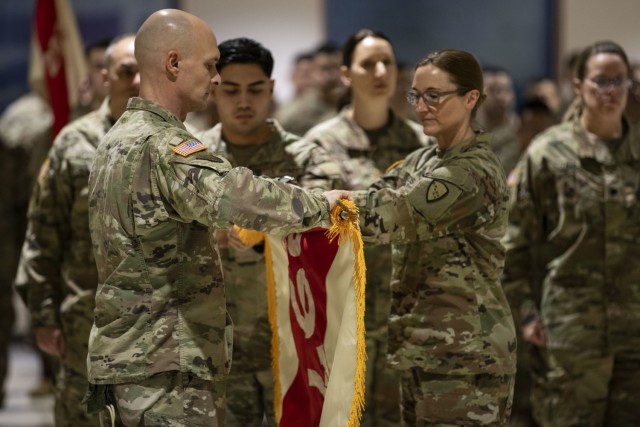 Alaska Army National Guard Col. Michele Edwards and Command Sgt. Maj. Russel Throckmorton, the commander and command sergeant major of the 297th Regional Support Group, case the unit colors during a deployment ceremony at the Alaska National Guard Armory on Joint Base Elmendorf-Richardson, Jan. 24, 2025. The Alaska Army National Guard’s Headquarters and Headquarters Company, 297th RSG, will deploy approximately 80 Guardsmen on a nine-month mission to Eastern Europe to support U.S. Army Europe and Africa’s Operation European Assure, Deter and Reinforce. (Alaska National Guard photo by Staff Sgt. Seth LaCount)