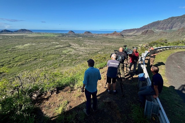 Reporters from broadcast networks across Oahu look out over Lualualei Naval Complex during Full-Scale Exercise Fortress Shield ‘25 Feb. 5. During the exercise, U.S. Army Garrison Hawaii, with joint partners from Joint Base Pearl Harbor-Hickam, City and County of Honolulu Department of Emergency Management, State of Hawaii Emergency Management Agency and Hawaii Department of Transportation, simulated a crisis situation on the west side of Oahu and the evacuation of motorists through Kolekole Pass. 