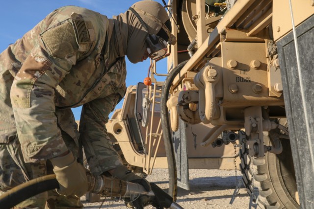 Pfc. Tyshawn Prude, assigned to  215th Brigade Support Battalion, prepares a Heavy Expanded Mobility Tactical Truck A4 fuel servicing truck to provide fuel to any unit vehicle conducting one of the many ongoing field exercises, on Fort Cavazos,...