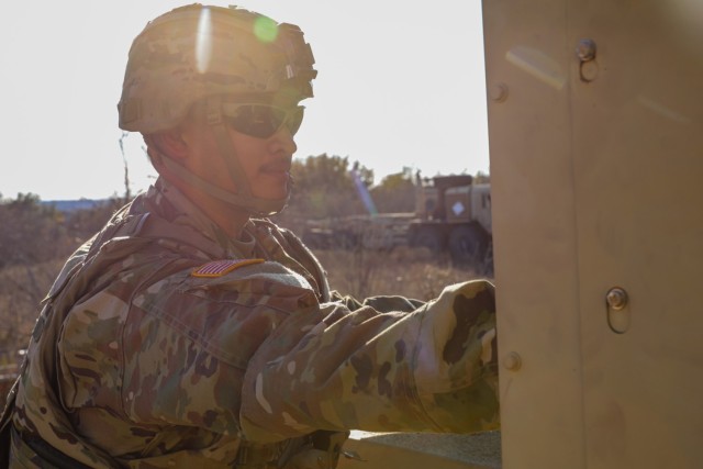 U.S. Army Pfc. William Ramirez, assigned to  215th Brigade Support Battalion, conducts preventive maintenance checks and services on an Advanced Medium Mobile Power Sources (AMMPS) generator during a field training exercise on Fort Cavazos, TX,...