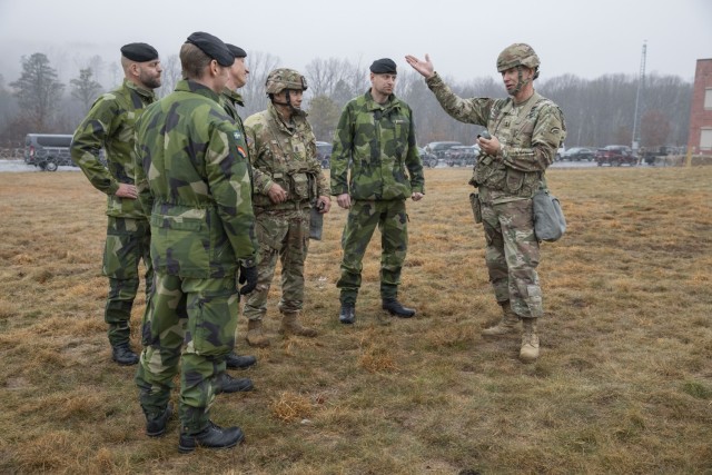 U.S. Army Maj. Gen. Jack A. James Jr., right, the commander of the New York National Guard’s 42nd Infantry Division, speaks with Swedish Army soldiers during the division’s Warfighter 25-3 exercise at Fort Indiantown Gap, Pa., Jan. 31, 2025. The Swedish soldiers’ participation with the New York Army National Guardsmen during Warfighter Exercise 25-3 marks their second visit with the 42nd Infantry Division and their first experience working with the United States in a division-level warfighter exercise. 