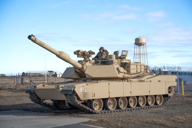 Tank commander Sgt. 1st Class Eric Gilliland, of 3rd Battalion, 116th Cavalry Regiment, communicates with driver Sgt. Maxwell Rounds from Castle Rock, Wash., as they maneuver their M1A2 SEP v2 Abrams tank onto the new six-mile tank trail at Raymond F. Rees Training Center in Umatilla, Oregon, Feb. 1, 2025. The new trail enables local National Guard tank crews to conduct essential driver training without traveling to out-of-state facilities.