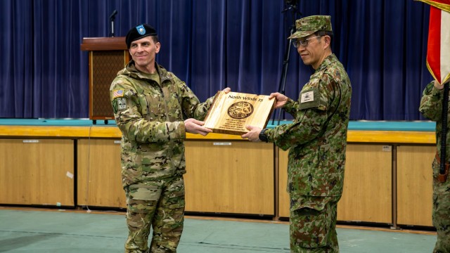 U.S. Army Lt. Col. Joseph Williams, commander of the 1st Battalion, 5th Infantry Regiment and Japan Ground Self Defense Force Col. Naoki Uehara, 18th Infantry Regiment, 11th brigade commander, exchange gifts as part of the North Wind 25 closing...