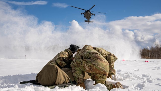 U.S. Soldiers from Headquarters and Headquarters Company, 1st Battalion, 5th Infantry Regiment, protect a casualty from rotor wash as part of casualty evacuation training in Hokudai-En, Japan, February 7, 2025. North Wind 25 is a bilateral...