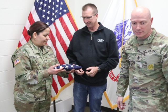 Fort McCoy Garrison Commander Col. Sheyla Baez-Ramirez presents a special U.S. flag to Fort McCoy Fire Chief Timothy Jorgenson on Jan. 29, 2025, at Fire Station 1 as part of Jorgenson’s retirement ceremony at Fort McCoy, Wis. Jorgenson retired...