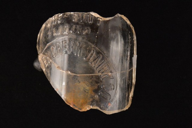 This glass shard was found in a 2015 archaeological dig at Fort McCoy, Wis. The piece of glass is from the Beaver Creek Dairy which operated in nearby Sparta, Wis. The artifact is among hundreds of thousands of artifacts found at the installation...