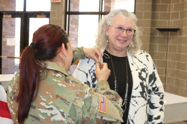 Fort McCoy Garrison Commander Col. Sheyla Baez-Ramirez completes a presentation Jan. 31, 2025, during a retirement ceremony for Fort McCoy Logistics Readiness Center employee Pamela Severson at Fort McCoy, Wis. Severson retired after serving the...