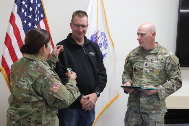Fort McCoy Garrison Commander Col. Sheyla Baez-Ramirez presents a medal to Fort McCoy Fire Chief Timothy Jorgenson on Jan. 29, 2025, at Fire Station 1 as part of Jorgenson’s retirement ceremony at Fort McCoy, Wis. Jorgenson retired with 32 years...