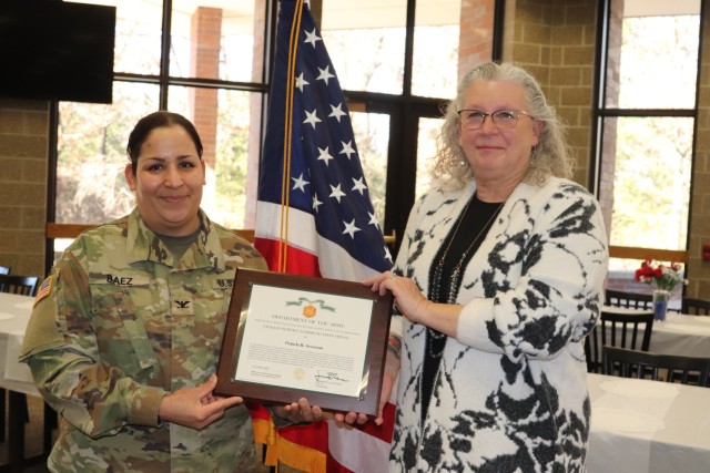 Fort McCoy Garrison Commander Col. Sheyla Baez-Ramirez completes a presentation Jan. 31, 2025, during a retirement ceremony for Fort McCoy Logistics Readiness Center employee Pamela Severson at Fort McCoy, Wis. Severson retired after serving the...