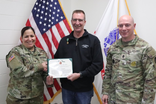 Fort McCoy Garrison Commander Col. Sheyla Baez-Ramirez presents a medal to Fort McCoy Fire Chief Timothy Jorgenson on Jan. 29, 2025, at Fire Station 1 as part of Jorgenson’s retirement ceremony at Fort McCoy, Wis. Jorgenson retired with 32 years...
