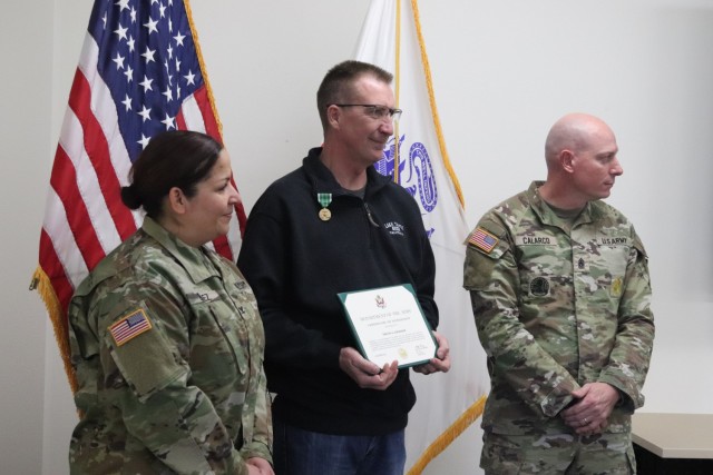 Fort McCoy Garrison Commander Col. Sheyla Baez-Ramirez presents a medal to Fort McCoy Fire Chief Timothy Jorgenson on Jan. 29, 2025, at Fire Station 1 as part of Jorgenson’s retirement ceremony at Fort McCoy, Wis. Jorgenson retired with 32 years...