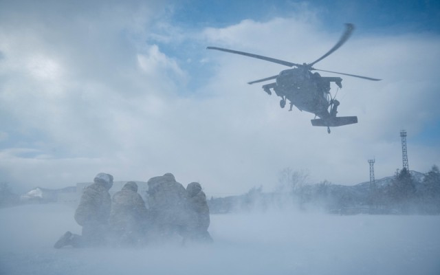 U.S. Soldiers with 1st Battalion, 5th Infantry Regiment, prepare to connect a sling load to a UH-60 Black Hawk during North Wind 25 at Camp Makomanai, Japan, February 5, 2025. North Wind 25 is a bilateral cold-weather field training exercise...