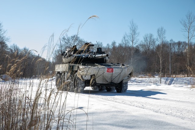 A Japan Ground Self Defense Force type 90 main battle tank advances on 1st Battalion, 5th Infantry Regiment Soldiers&#39; position, during the culminating field training exercise of North Wind 25, at Camp Minami-Eniwa, Hokkaido, Japan, February 8,...