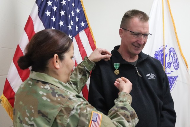 Fort McCoy Garrison Commander Col. Sheyla Baez-Ramirez presents a medal to Fort McCoy Fire Chief Timothy Jorgenson on Jan. 29, 2025, at Fire Station 1 as part of Jorgenson’s retirement ceremony at Fort McCoy, Wis. Jorgenson retired with 32 years...