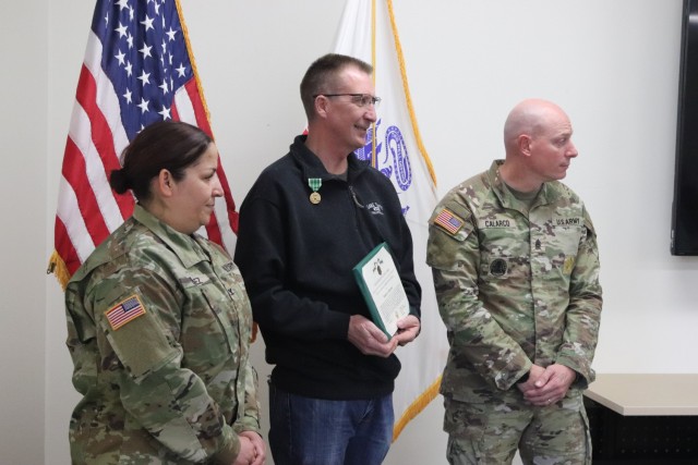 Fort McCoy Garrison Commander Col. Sheyla Baez-Ramirez presents a medal to Fort McCoy Fire Chief Timothy Jorgenson on Jan. 29, 2025, at Fire Station 1 as part of Jorgenson’s retirement ceremony at Fort McCoy, Wis. Jorgenson retired with 32 years...