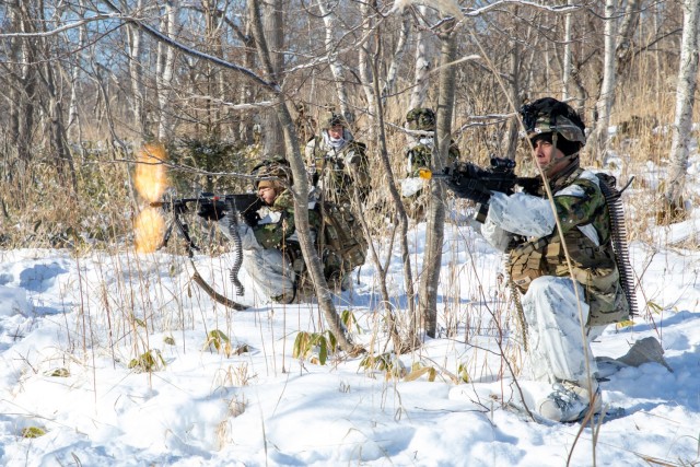 U.S. Army Pfc. Abraham Garcia (left) and Spc. William Sisk both infantrymen from Alpha Company, 1st Battalion, 5th Infantry Regiment participate in the culminating field training exercise during North Wind 25, at Camp Minami-Eniwa, Hokkaido,...