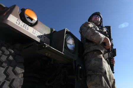 Spc. Marcus Galicia, an infantryman with B Company, 2nd Battalion, 142nd Infantry Regiment, Texas Army National Guard, monitors an area along the southern border near Brownsville, Texas, as part of an operation with the Texas T...