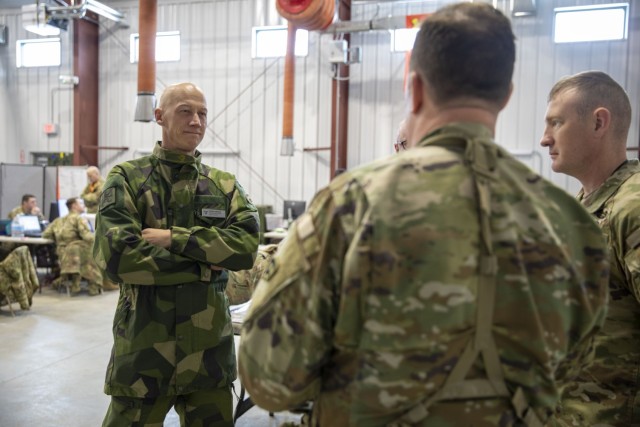 FORT INDIANTOWN GAP, Pa. – Swedish Army Lt. Col. Fredrik Mansson, the chief of operations for the 1st Division Headquarters, speaks with U.S. Army senior leaders from the New York National Guard’s 42nd Infantry Division during the division’s Warfighter 25-3 exercise at Fort Indiantown Gap, Pa., Feb. 3, 2025. Sweden is the New York National Guard’s newest partner through the National Guard State Partnership Program, which provides for military-to-military engagements supporting defense security goals while enhancing relationships and capabilities with allies and international partners. 