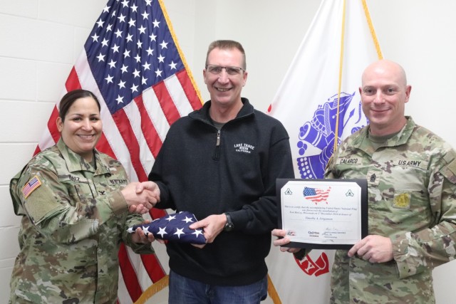 Fort McCoy Garrison Commander Col. Sheyla Baez-Ramirez presents a special U.S. flag to Fort McCoy Fire Chief Timothy Jorgenson on Jan. 29, 2025, at Fire Station 1 as part of Jorgenson’s retirement ceremony at Fort McCoy, Wis. Jorgenson retired...