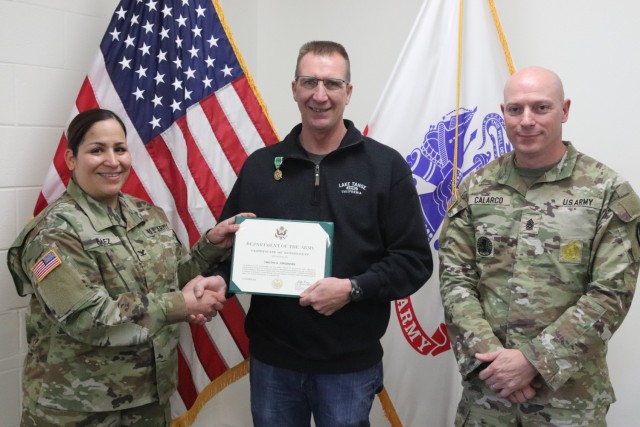Fort McCoy Garrison Commander Col. Sheyla Baez-Ramirez presents a medal to Fort McCoy Fire Chief Timothy Jorgenson on Jan. 29, 2025, at Fire Station 1 as part of Jorgenson’s retirement ceremony at Fort McCoy, Wis. Jorgenson retired with 32 years...