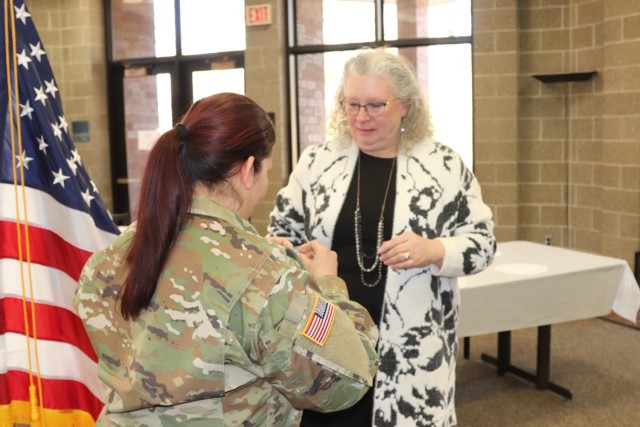 Fort McCoy Garrison Commander Col. Sheyla Baez-Ramirez completes a presentation Jan. 31, 2025, during a retirement ceremony for Fort McCoy Logistics Readiness Center employee Pamela Severson at Fort McCoy, Wis. Severson retired after serving the...