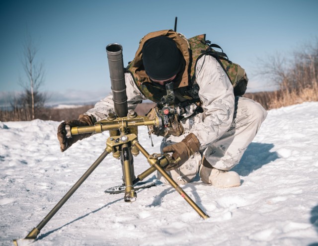 U.S. Army Spc. Joshua Milliman, a mortarman with Alpha Company, 1st Battalion, 5th Infantry Regiment, sets up a 60 mm mortar system during North Wind 25 in Minami-eniwa, Japan, February 8, 2025. North Wind 25 is a bilateral cold-weather field...