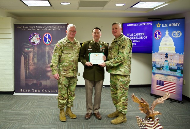 Sgt. 1st Class Stephen Hughes (center) poses with Command Sgt. Maj. Vern Daley (left) and Maj. Gen. Trever Bredenkamp, Commanding General of the U.S. Army Military District of Washington (USAMDW). Hughes was named the winner of the USAMDW Career...