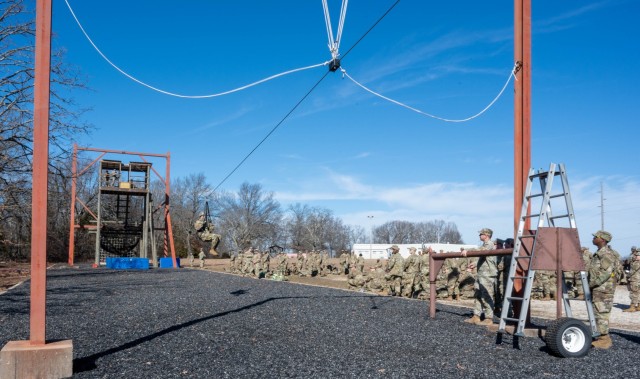 Five trainees from Company C, 3rd Battalion, 10th Infantry Regiment, 3rd Chemical Brigade are among the first to get to zip down the Slide for Life obstacle, which was closed for nearly a decade, Feb. 3 at Training Area 97. The five trainees were...