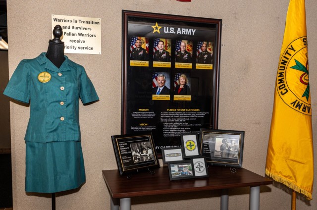 Lela Williams&#39; 1970s Army Community Service volunteer uniform sits displayed with images of her in a static display at Fort Knox, Kentucky, Feb. 12, 2025. Williams has been a volunteer with the installation for over 50 years through ACS and...
