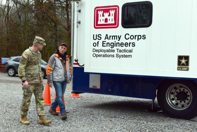 Jerry Breznican, U.S. Army Corps of Engineers Nashville District Emergency Management chief, briefs USACE Command Sgt. Maj. Douglas Galick Feb. 12, 2025, about Hurricane Helene debris operations at the Emergency Command and Control Vehicle on the...