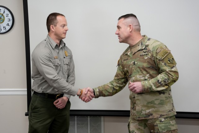 U.S. Army Corps of Engineers Command Sergeant Major Douglas Galick (right) presents his coin to Phillip Sliger, Center Hill Natural Resource specialist, in recognition of Sliger’s hard work and professionalism in carrying out the U.S. Army Corps...