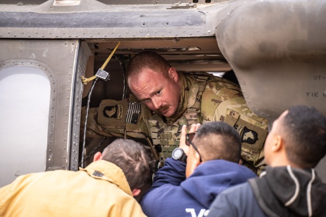 Soldiers assigned to Task Force Shikra train in conjunction with the ASG Kuwait Fire Department on UH-60 crew extraction on Camp Buehring, Kuwait, February 11, 2025. Aircraft familiarization and recovery operations ensure both crews and first...