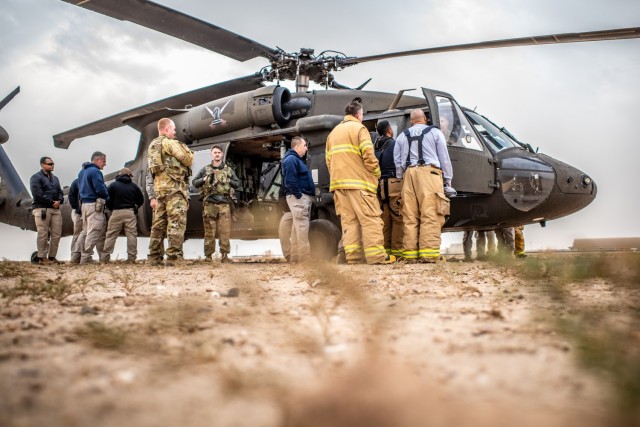 Soldiers assigned to Task Force Shikra train in conjunction with the ASG Kuwait Fire Department on UH-60 crew extraction on Camp Buehring, Kuwait, February 11, 2025. Aircraft familiarization and recovery operations ensure both crews and first...