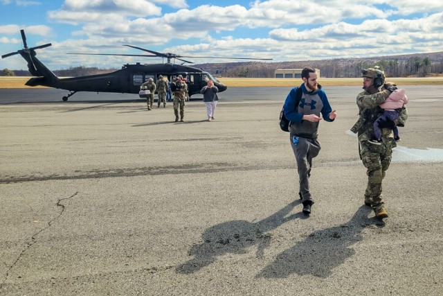 Airmen from the Kentucky Air National Guard’s 123rd Contingency Response Group receive flood victims arriving at the Big Sandy Regional Airport in Debord, Kentucky, Feb. 17, 2025. The evacuees were airlifted aboard Kentucky and Indiana Army...