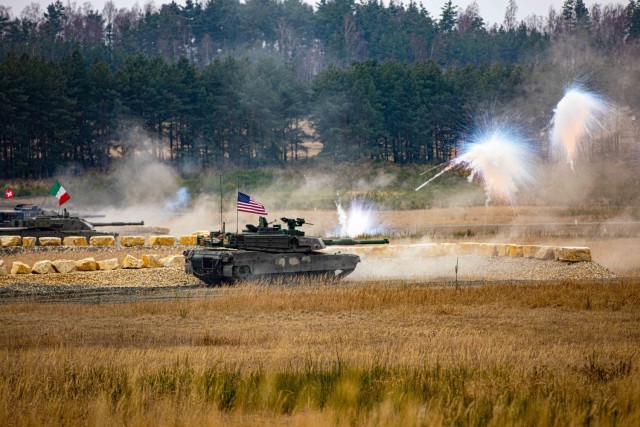 U.S., Swiss and Italian tankers participate in the opening ceremony of the U.S. Army Europe and Africa International Tank Challenge at the 7th Army Training Command&#39;s Grafenwoehr Training Area, Germany, Feb. 11, 2025. The challenge was designed to build tactical skills and enhance esprit de corps.