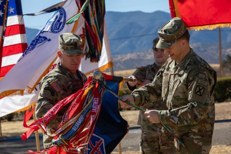 U.S. Army Maj. Gen. Scott Naumann, the 10th Mountain Division and Fort Drum commander, and Command Sgt. Maj. Brett Johnson, the 10th Mountain Division command sergeant major, unfurl the division colors during a ceremony at Fort Huachuca, Arizona, Feb. 18, 2025. This uncasing ceremony is to indicate the beginning of the 10th Mountain Divisions deployment in support of the Southern Border Mission. U.S. Northern Command is working together with the Department of Homeland Security to augment U.S. Customs and Border Protection along the Southern border with additional military forces. This initial deployment of more than 1,600 active-duty personnel brings the total military Title 10 forces along the border to approximately 4,000 personnel. 