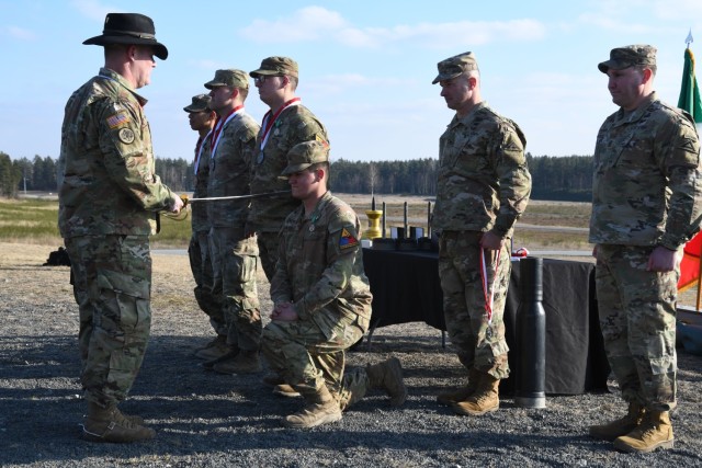 U.S. soldiers receive the Order of Saint George Medallion after placing first in the U.S. Army Europe and Africa International Tank Challenge sponsored by the 7th Army Training Command in Grafenwoehr, Germany, Feb. 17, 2025.
